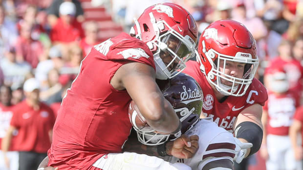 Razorbacks quarterback KJ Jefferson hit by Mississippi State's Nathan Pickering